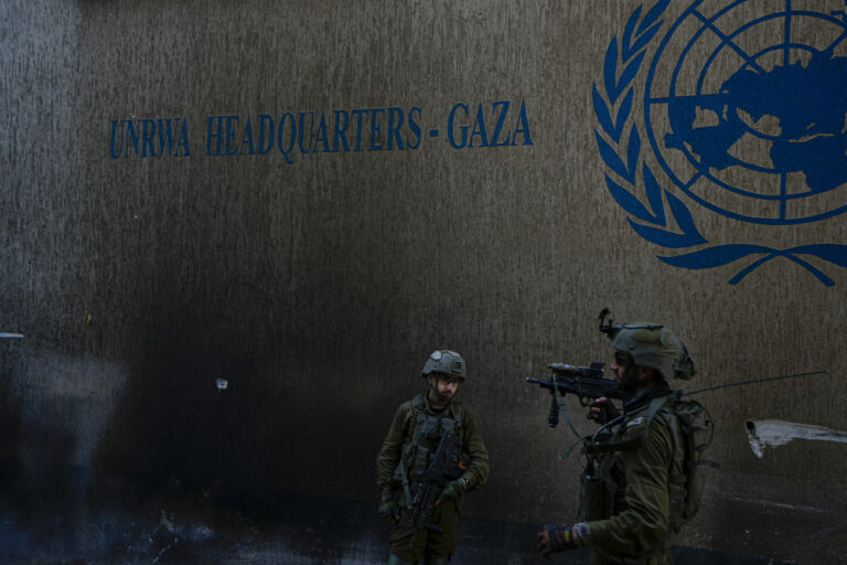 Israeli soldiers take up position as they enter the UNRWA headquarters, where the military discovered tunnels underneath the U.N. agency that the military says Hamas militants used to attack its forces during a ground operation in Gaza, Thursday, Feb. 8, 2024. The Israeli military says it has discovered tunnels underneath the main headquarters of the U.N. agency for Palestinian refugees in Gaza City, alleging that Hamas militants used the space as an electrical supply room. The unveiling of the tunnels marked the latest chapter in Israel's campaign against the embattled agency, which it accuses of collaborating with Hamas. (AP Photo/Ariel Schalit)
