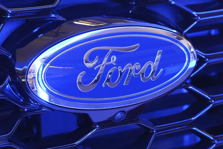 This is the Ford logo on the grill of a Ford Explorer on display at the Pittsburgh International Auto Show in Pittsburgh, Feb. 15, 2024. (AP Photo/Gene J. Puskar)