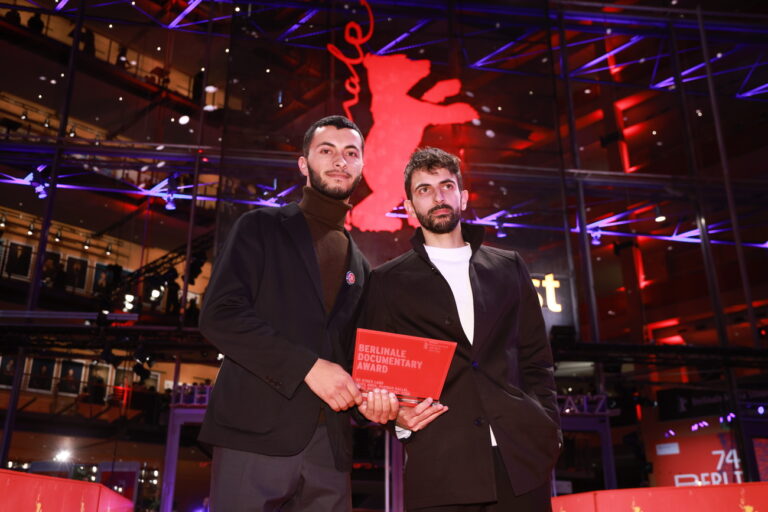 epa11179035 Basel Adra and Yuval Abraham pose with the Berlinale documentary award for the movie 
