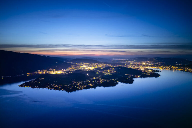 A general view from mount Buergenstock over the Lake Lucerne, with the city of Lucerne, back right, and Kastanienbaum, center, on Thursday, April 11, 2024 in Obbuergen, central Switzerland. Switzerland's Buergenstock resort is to host a two-day peace conference in June, the Swiss government announced. (KEYSTONE/Michael Buholzer)