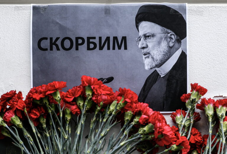 epa11355324 The portrait of the late Iranian President Ebrahim Raisi is displayed among flowers laid outside the Iranian embassy, following the deaths of Iran's president Raisi and Foreign Minister Amir-Abdollahian, in Moscow, Russia, 20 May 2024. According to Iranian state media, President Raisi, Foreign Minister Hossein Amir-Abdollahian and several others were killed in a helicopter crash in the mountainous Varzaghan area on 19 May, during their return to Tehran, after an inauguration ceremony of the joint Iran-Azerbaijan constructed Qiz-Qalasi dam at the Aras river. Iran's first Vice President Mohammad Mokhber was appointed as the country's interim president following the death of Raisi, Iranian supreme leader Ayatollah Ali Khamenei announced in a condolence message on 20 May 2024. EPA/YURI KOCHETKOV