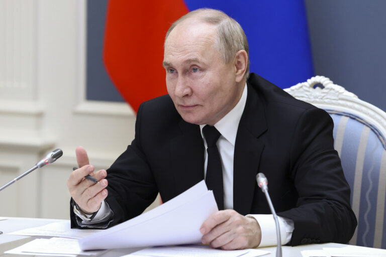 Russian President Vladimir Putin gestures as he speaks at a meeting with large families from various Russia's regions via videoconference at the Kremlin in Moscow, Russia, Thursday, May 30, 2024. (Alexander Kazakov, Sputnik, Kremlin Pool Photo via AP)