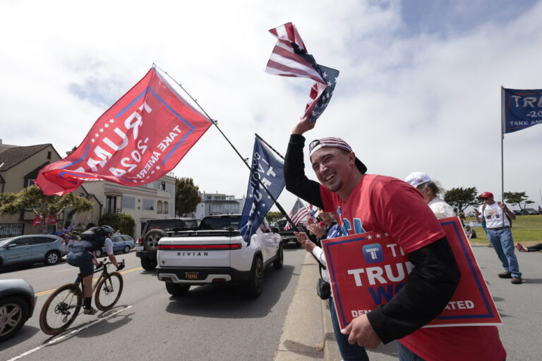 epa11394865 Pro-Trump supporters show their support before former President Donald J. Trump visits a fundraiser in San Francisco, California, USA, 06 June 2024. EPA/JOHN G. MABANGLO