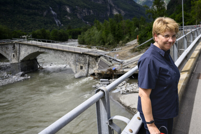 Swiss Federal President Viola Amherd visits the collapsed Visletto bridge between Visletto and Cevio, in the Maggia Valley during a visit of regions hit by bad weather, in Visletto, Switzerland, Monday, July 1, 2024. Severe storms and torrential rain in Switzerland over the weekend left three people dead in Val Maggia and its side valleys in Ticino, and one person still missing. A man was also found dead in a hotel in Saas-Grund, in the south-western canton of Valais and one person still missing. (KEYSTONE/Jean-Christophe Bott)