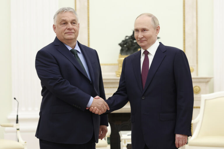 Russian President Vladimir Putin, right, and Hungarian Prime Minister Viktor Orban shake hands during a meeting in Moscow, Russia, Friday, July 5, 2024. (Valeriy Sharifulin, Sputnik, Kremlin Pool Photo via AP)