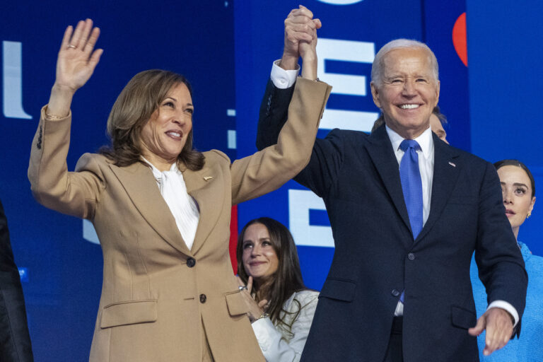 Democratic presidential nominee Vice President Kamala Harris, left, clasps her hand in the air with President Joe Biden at the Democratic National Convention, Monday, Aug. 19, 2024, in Chicago. (AP Photo/Jacquelyn Martin).Kamala Harris,Joe Biden