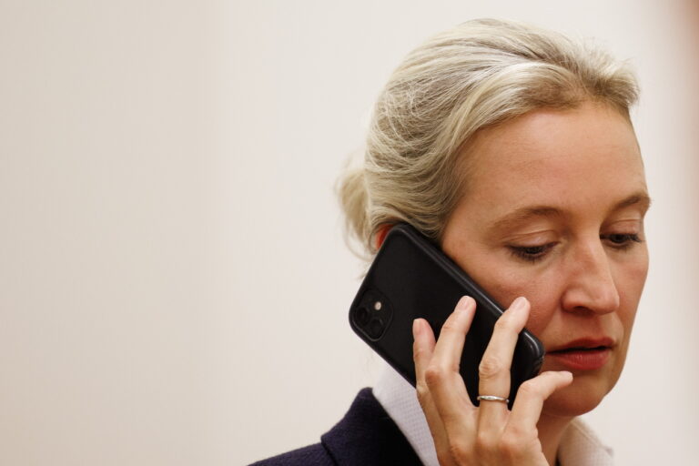 epa11619831 Alternative for Germany (AfD) party and faction co-chairwoman Alice Weidel talks on the phone in the regional state parliament during the regional state parliament election in Brandenburg, in Potsdam, Germany, 22 September 2024. Regional state parliament election in Brandenburg takes place on 22 September 2024. EPA/CLEMENS BILAN