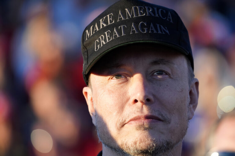 Tesla and SpaceX CEO Elon Musk listens as Republican presidential nominee former President Donald Trump speaks at a campaign event at the Butler Farm Show, Saturday, Oct. 5, 2024, in Butler, Pa. (AP Photo/Alex Brandon).Donald Trump