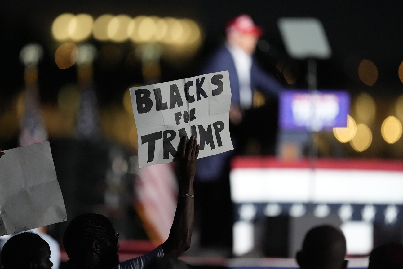 FILE - A supporter holds up a sign as Republican presidential candidate former President Donald Trump speaks at a campaign rally at Trump National Doral Miami, July 9, 2024, in Doral, Fla. (AP Photo/Rebecca Blackwell, File)