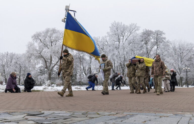 Fellow soldiers carry a coffin of leading actor of the music and drama theatre Petro Velykiy, 48, who was killed in a battle with the Russian troops in Russia's Kursk region, during farewell ceremony in Chernyhiv, Ukraine, Wednesday, Nov. 27, 2024.(AP Photo/Dan Bashakov)