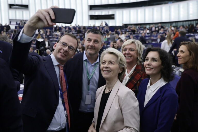 epa11743802 European Commission President Ursula von der Leyen (C) and Commissioner-designate for Preparedness and Crisis Management, and for Equality Hadja Lahbib (R) pose for a selfie with members of the European Parliament following the election of the Commissioners-designate members at the European Parliament in Strasbourg, France, 27 November 2024. The EU Parliament's session runs from 25 till 28 November 2024. EPA/RONALD WITTEK