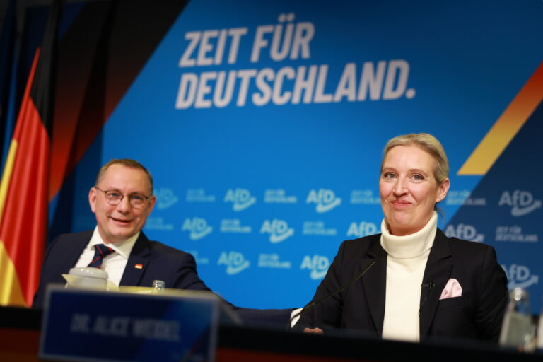 epa11761838 Alternative for Germany (AfD) party and faction co-chairwoman and top candidate for the federal election Alice Weidel (R) looks on next to Alternative for Germany (AfD) party and faction co-chairman Tino Chrupalla (L), during a press conference of the Alternative for Germany (AfD) in Berlin, Germany, 07 December 2024. The Alternative for Germany (AfD) party held a press conference to present their Chancellor candidate ahead of the upcoming German federal election. EPA/CLEMENS BILAN