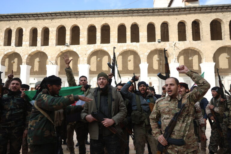 epa11765263 Syrian rebels celebrate inside the Umayyad Mosque in central Damascus, Syria, 08 December 2024. Syrian rebels entered Damascus on 08 December 2024 and announced in a televised statement the 'Liberation of the city of Damascus and the overthrow of Bashar al-Assad,' as well as the release of all the prisoners. The rebels also urged the Syrian armed forces to leave Syrian public institutions, which will stay under the control of the outgoing Syrian prime minister until the official handover ceremony. EPA/MOHAMMED AL RIFAI