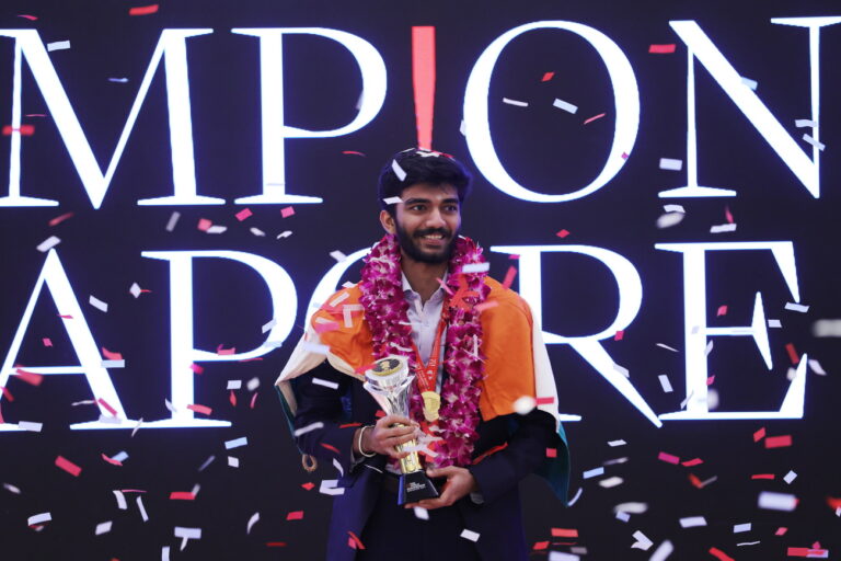 epa11774452 Chess grandmaster Gukesh Dommaraju of India celebrates with his trophy amid confetti during a prize presentation at the closing ceremony of the FIDE World Chess Championship in Singapore, 13 December 2024. Gukesh Dommaraju became the youngest ever Chess World Champion by beating Ding Liren of China in the best-of-14-games championships. EPA/HOW HWEE YOUNG