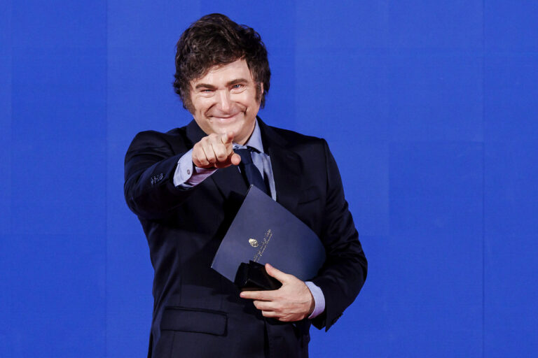 Argentina's President Javier Milei waves during Atreju 2024, event organized by the Fratelli d'Italia party at the Circo Massimo, Rome, Saturday, Dec 14, 2024 (Roberto Monaldo/LaPresse via AP)