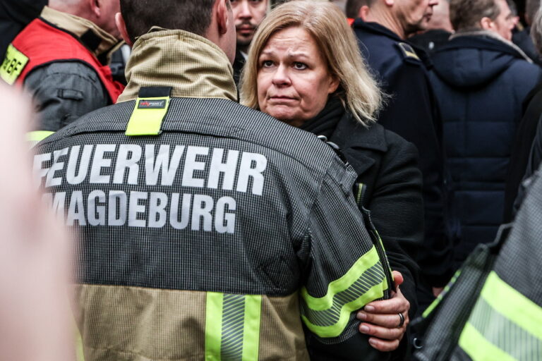 epa11788343 German Federal Minister of the Interior and Community Nancy Faeser (R) speaks with a firefighter as she visits the scene of a vehicle-ramming attack on the Christmas market in Magdeburg, Germany, 21 December 2024. According to the Magdeburg police, at least two people were confirmed dead, scores were injured, and the suspect, a Saudi national, was taken into custody after he drove a car into a crowd at Magdeburg's Christmas market on 20 December. EPA/FILIP SINGER