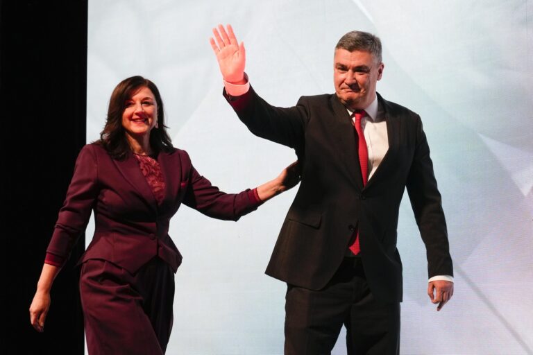 Incumbent president and presidential candidate Zoran Milanovic, right, greets supporters after his headquarters claimed victory in elections in Zagreb, Croatia, Sunday, Dec. 29, 2024. (AP Photo/Darko Bandic)