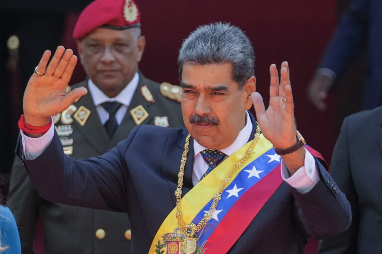 Venezuelan President Nicolas Maduro waves after being sworn in for a third term in Caracas, Venezuela, Friday, Jan. 10, 2025. (AP Photo/Matias Delacroix)