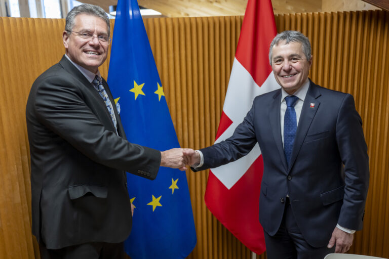 Maros Sefcovic, EU Commissioner for Trade and Economic Security, left, shakes hands with Switzerland's Foreign Minister Federal Councillor Ignazio Cassis, right, prior to a bilateral meeting on the sideline of the 55th annual meeting of the World Economic Forum, WEF, in Davos, Switzerland, Wednesday, January 22, 2025. (KEYSTONE/POOL/Laurent Gillieron)