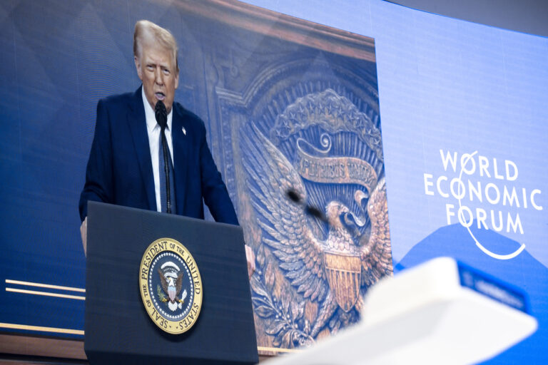 US President Donald J. Trump is shown on screens as he addresses via remote connection a plenary session in the Congress Hall, during the 55th annual meeting of the World Economic Forum, WEF, in Davos, Switzerland, on Thursday, January 23, 2025. (KEYSTONE/Laurent Gillieron)