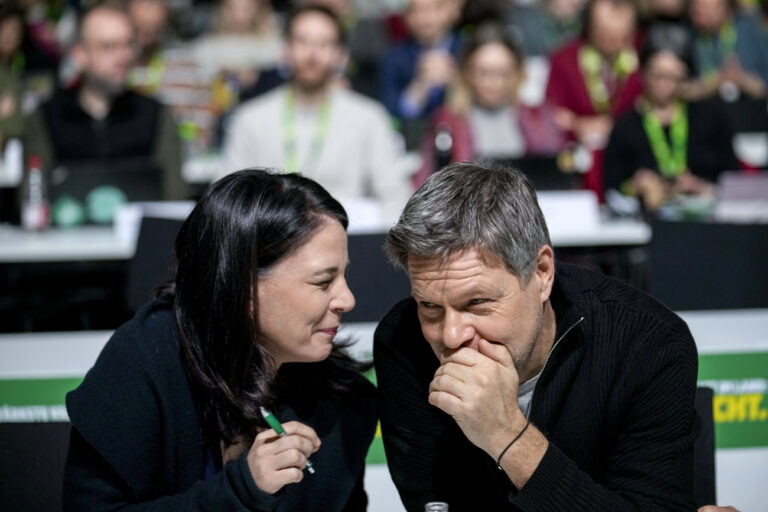 Green Party top candidate, federal minister for economy Robert Habeck, right, speaks with German Foreign Minister Annalena Baerbock at a party convention in, Berlin, Germany, Sunday, Jan. 26, 2025. (AP Photo/Ebrahim Noroozi)