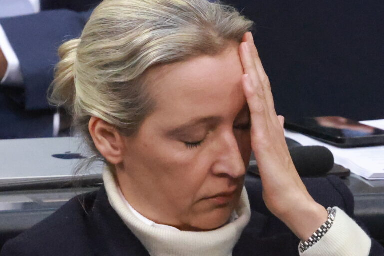 epa11860496 Alternative for Germany (AfD) party and faction co-chairwoman Alice Weidel touches her face as Chairman of the Christian Democratic Union (CDU) party and faction Friedrich Merz (not in the picture) speaks during a session of the German parliament 'Bundestag' in Berlin, Germany, 29 January 2025. One of the main topics of session of the Bundestag is the delivery of a government statement by German Chancellor Olaf Scholz on current domestic policy issues. EPA/CLEMENS BILAN