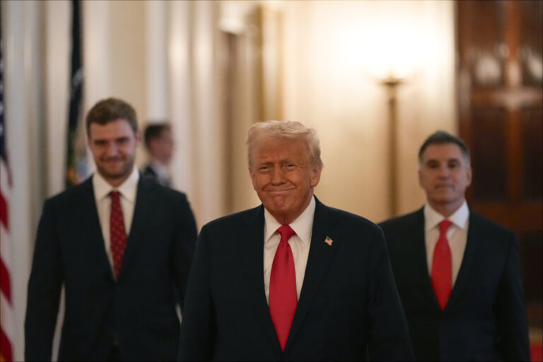 President Donald Trump arrives with Aleksander Barkov, left, and owner Vincent Viola to speak during a ceremony with the Florida Panthers NHL hockey team to celebrate their 2024 Stanley Cup victory in the East Room of the the White House, Monday, Feb. 3, 2025, in Washington. (AP Photo/Alex Brandon)