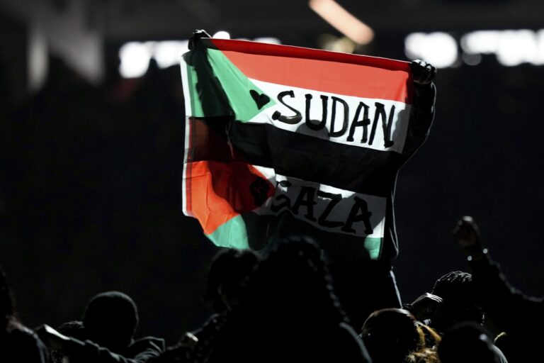 A flag is raised during halftime of the NFL Super Bowl 59 football game between the Kansas City Chiefs and the Philadelphia Eagles, Sunday, Feb. 9, 2025, in New Orleans. (AP Photo/Matt Slocum)