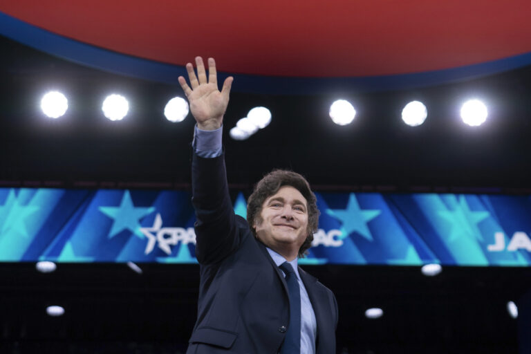 Argentina's President Javier Milei waves to the crowd before speaking at the Conservative Political Action Conference, CPAC, at the Gaylord National Resort & Convention Center, Saturday, Feb. 22, 2025, in Oxon Hill, Md. (AP Photo/Jose Luis Magana)