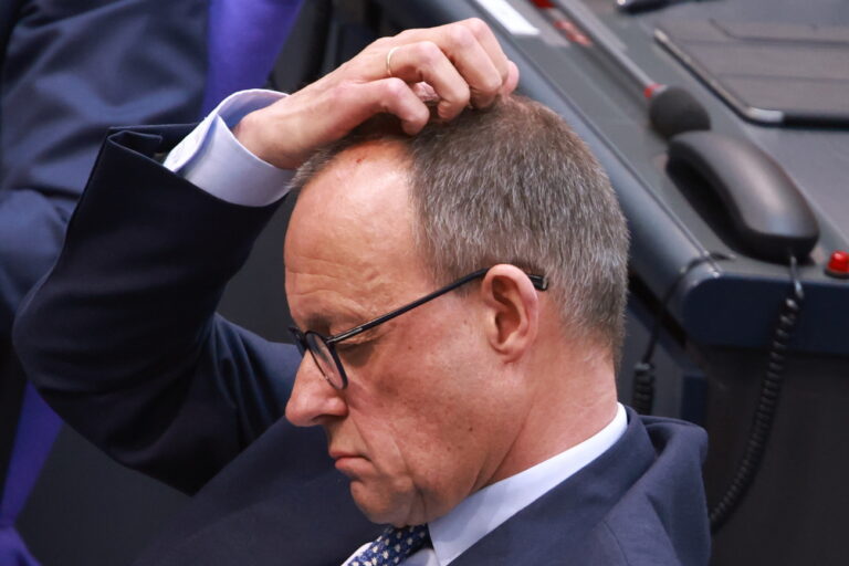 epa11960575 Chairman of the Christian Democratic Union (CDU) party and faction Friedrich Merz touches his head during a session of the German parliament 'Bundestag' in Berlin, Germany, 13 March 2025. The members of Parliament discuss an amendment of the German basic law. The Christian Democratic Union (CDU) aims to release a billion-euro defense and infrastructure package. EPA/CLEMENS BILAN