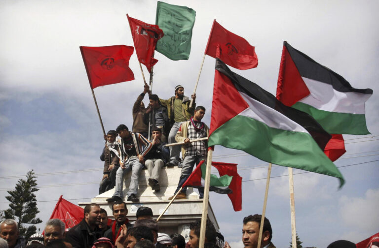 Palestinian supporters of the Democratic Front for the Liberation of Palestine carry flags during a rally by the group celebrating forty years since its founding in Gaza City , Saturday , Feb. 28, 2009. Founded in 1969 the DFLP is a Palestinian Marxist-Leninist, secular political and military organization.(AP Photo/Hatem Moussa)