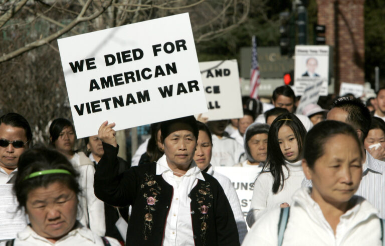 Hundreds of members of the Hmong community demonstrated against federal charges facing members of the community and a former U.S. Army officer accused of attempting to overthrow the Laotian government, outside the federal courthouse in Sacramento, Calif., Monday, March 15, 2010. Only 10 of the 12 accused appeared in federal court for a status hearing, where Judge Frank Damrell, Jr., set their next court appearance to be in Sept. 2010. (AP Photo/Rich Pedroncelli)