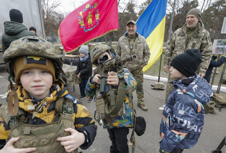 epa11856366 Ukrainian children attend an exhibition of weapons organized by the 65th Separate Mechanized Brigade after their new recruiting center opened in Kyiv, Ukraine, 27 January 2025, amid the ongoing Russian invasion. The 65th Separate Mechanized Brigade, defending Zaporizhzhia, announced the opening of recruiting centers in several cities nationwide to attract new, motivated, and conscientious fighters. EPA/SERGEY DOLZHENKO